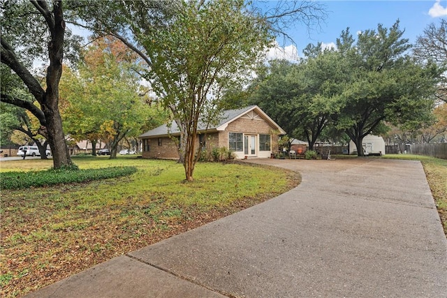 ranch-style home with a front lawn