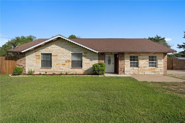 single story home with a front yard