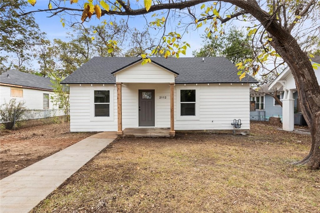 bungalow-style house featuring central air condition unit