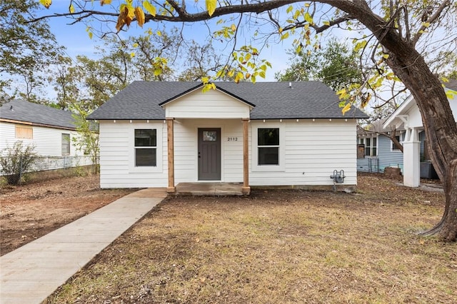 bungalow-style house featuring central air condition unit