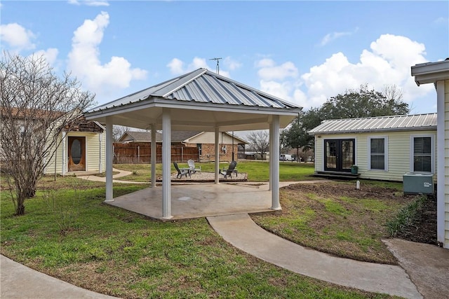 view of yard featuring an outbuilding, a gazebo, and a patio area