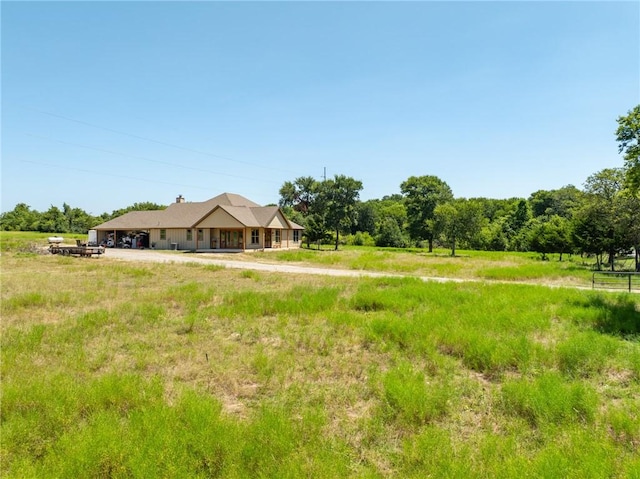 view of yard with a rural view