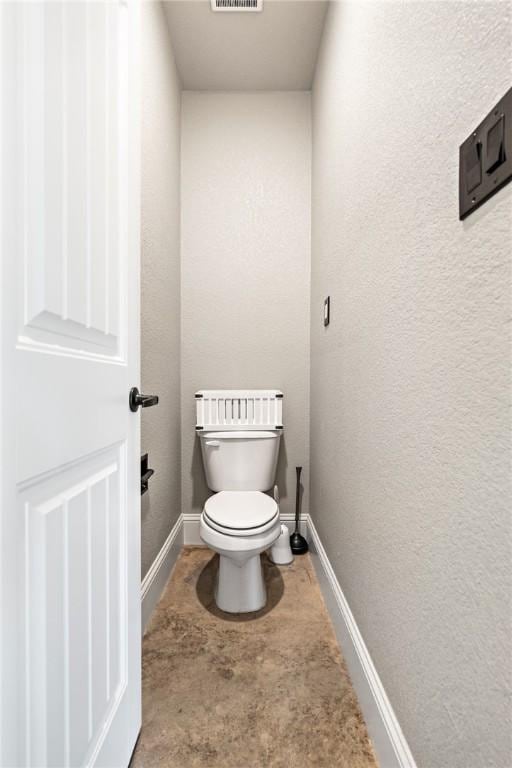 bathroom featuring toilet