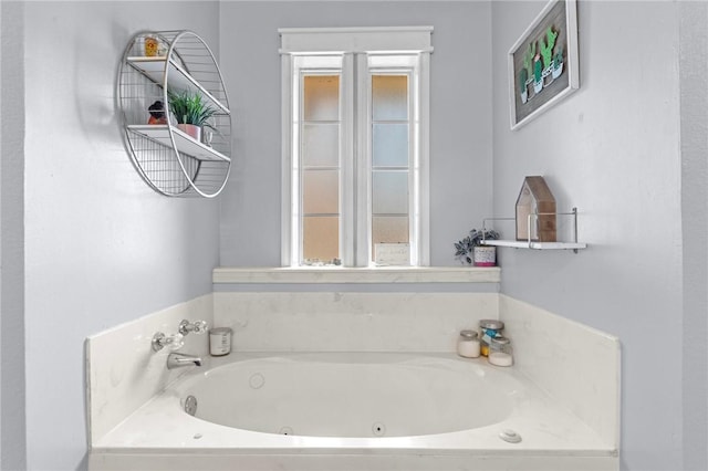 bathroom featuring a tub to relax in