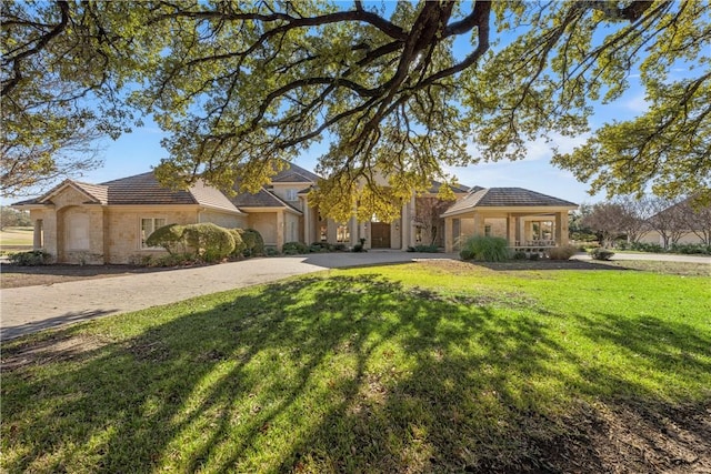 ranch-style home with a front lawn