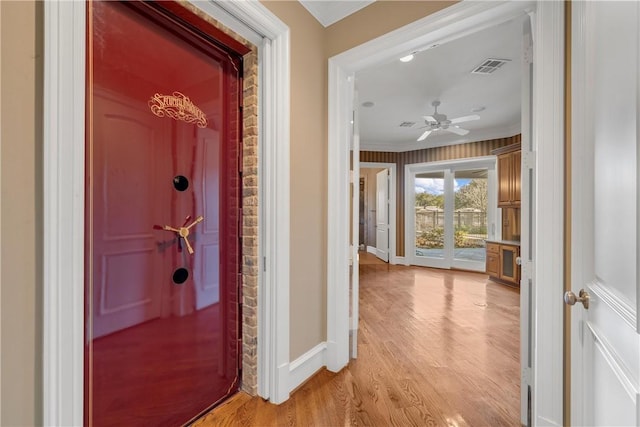 hallway with light hardwood / wood-style flooring