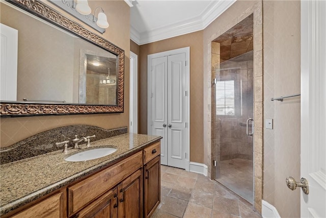 bathroom featuring ornamental molding, a shower with shower door, decorative backsplash, and vanity