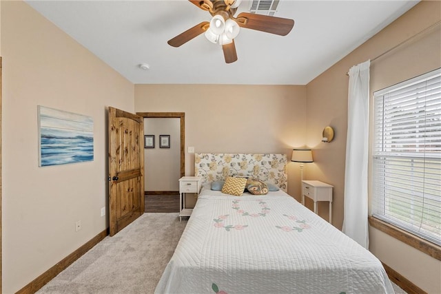 bedroom with visible vents, carpet flooring, a ceiling fan, and baseboards