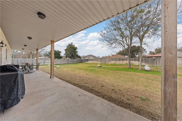 view of patio with a grill and a fenced backyard