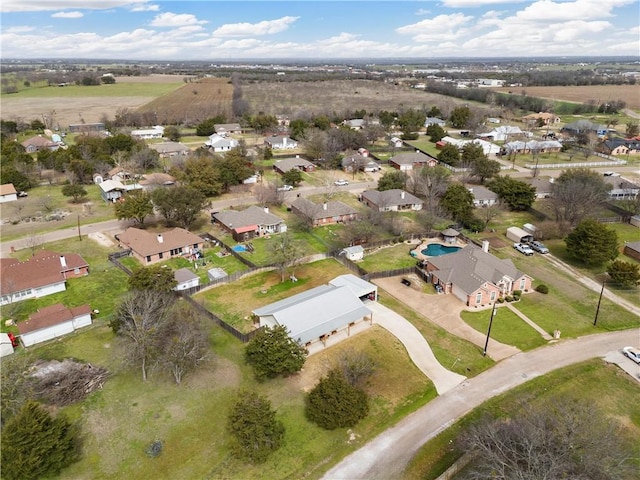 birds eye view of property with a residential view