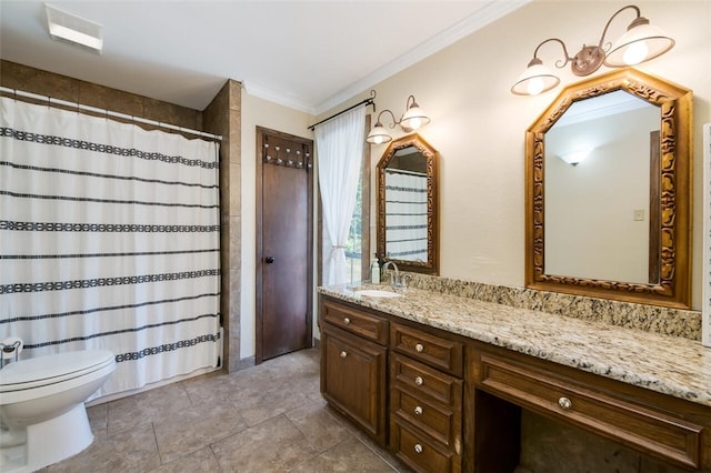 bathroom with vanity, toilet, and crown molding