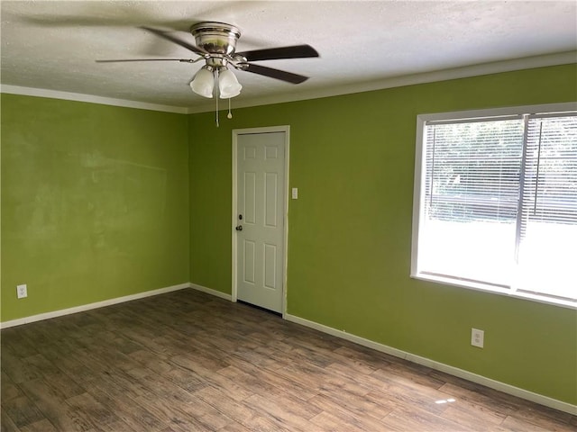 spare room with crown molding, hardwood / wood-style floors, ceiling fan, and a textured ceiling