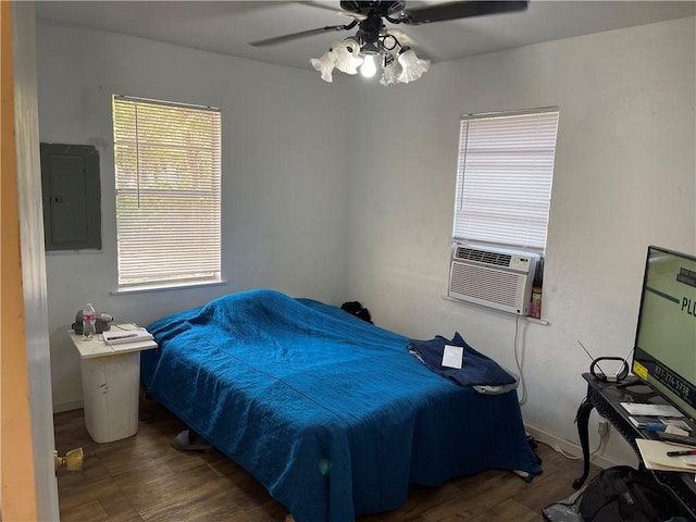 bedroom with electric panel, ceiling fan, dark hardwood / wood-style flooring, and cooling unit