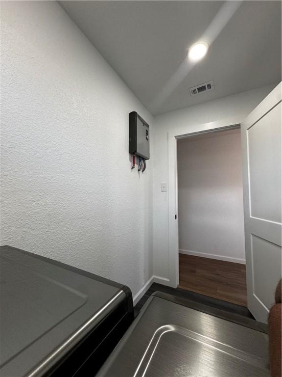 empty room featuring hardwood / wood-style floors and ceiling fan