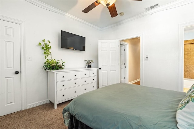 carpeted bedroom featuring ceiling fan, ornamental molding, and ensuite bath