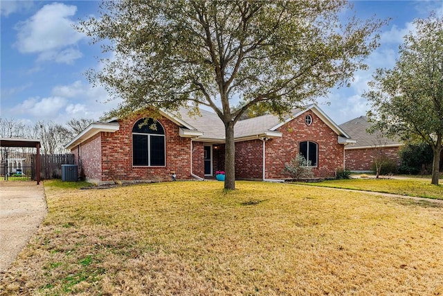 single story home featuring brick siding, a front lawn, and fence