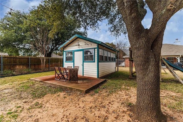 view of outbuilding featuring an outbuilding and fence private yard