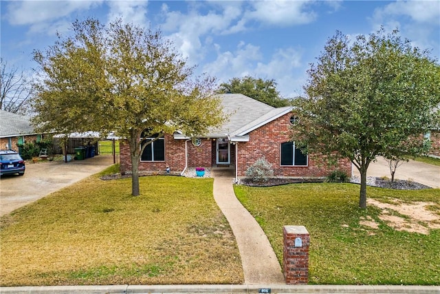 view of front of house with a front lawn and brick siding