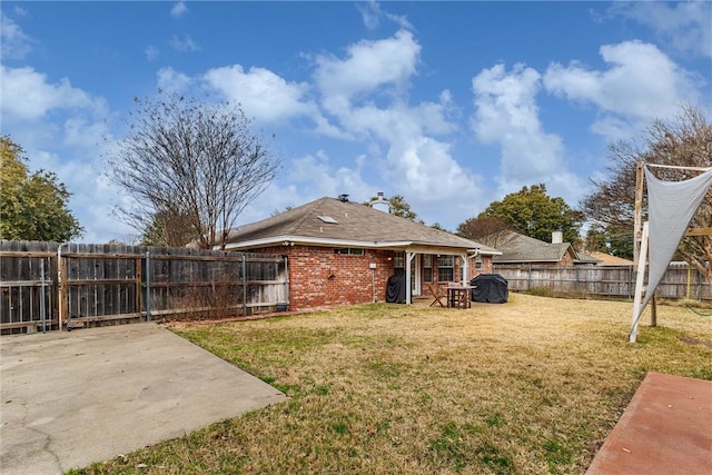 view of yard with a patio area and a fenced backyard