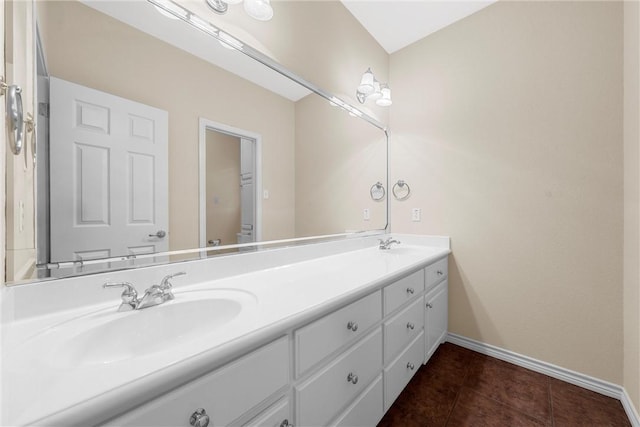 bathroom with tile patterned floors and vanity