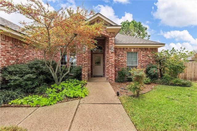 view of front of property with a front lawn