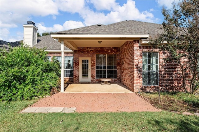 rear view of property featuring a patio