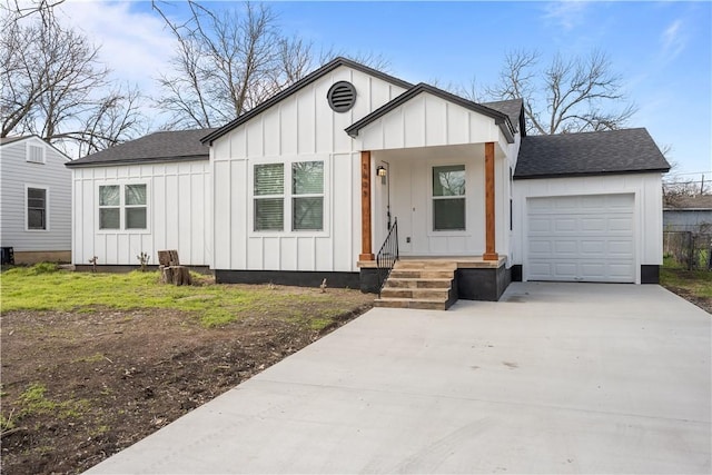 modern farmhouse style home featuring a garage, roof with shingles, board and batten siding, and concrete driveway