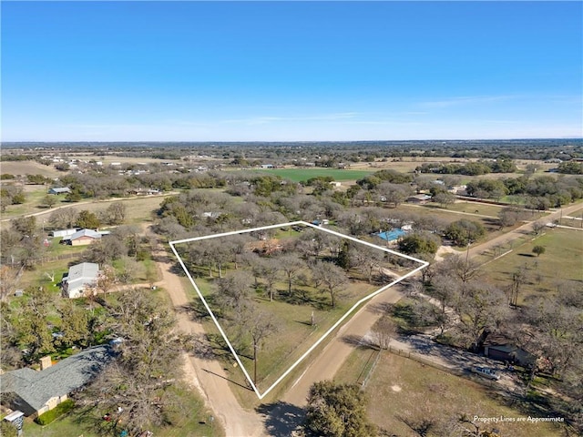 birds eye view of property featuring a rural view