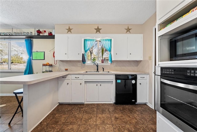 kitchen featuring tasteful backsplash, sink, white cabinets, and stainless steel appliances