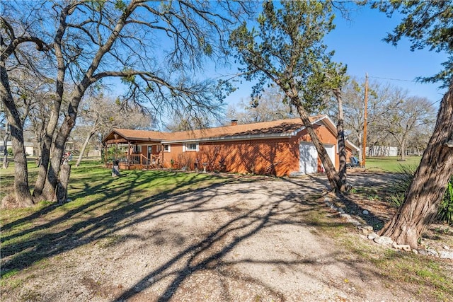 view of front of house with a garage and a front yard