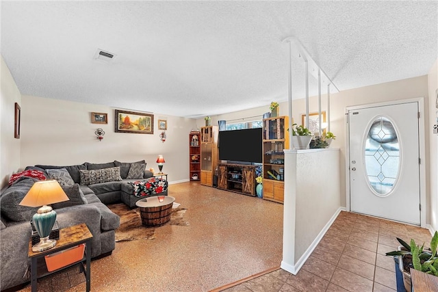 living room featuring a textured ceiling