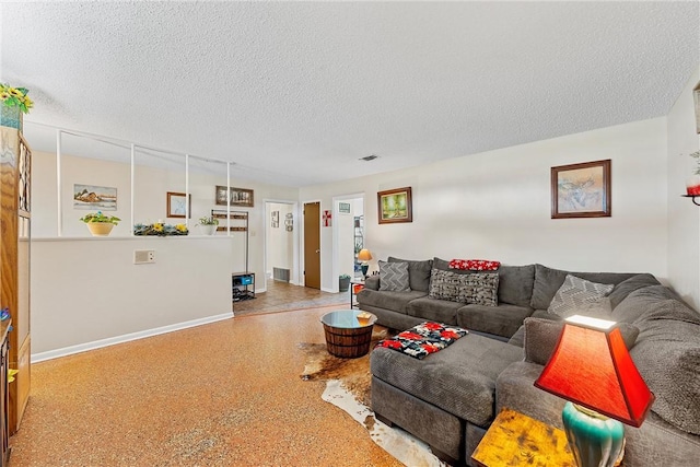 living room with a textured ceiling