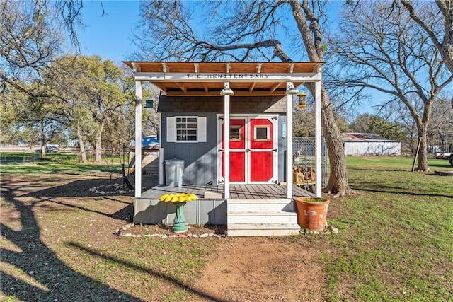 view of outbuilding with a yard