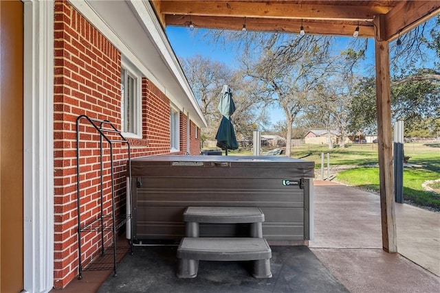 view of patio / terrace featuring a hot tub