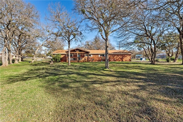 view of yard with a wooden deck