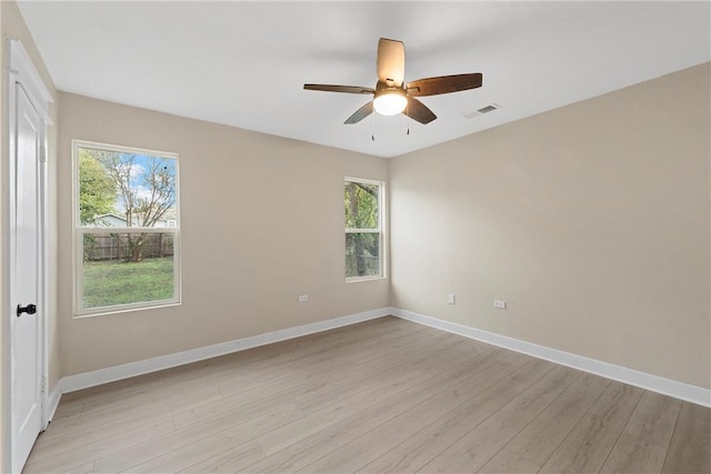 unfurnished room featuring ceiling fan and light wood-type flooring