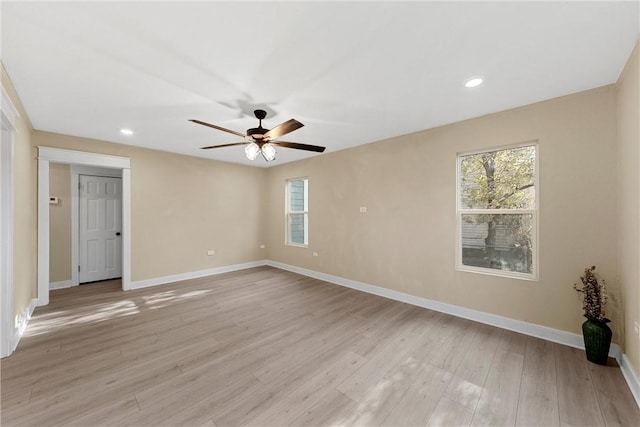 unfurnished room with ceiling fan and light hardwood / wood-style flooring