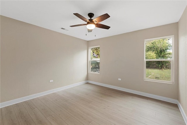 empty room featuring ceiling fan and light wood-type flooring