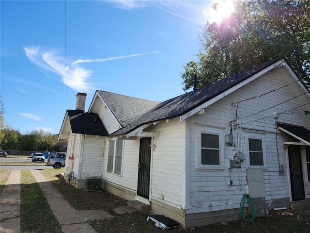 view of home's exterior with cooling unit