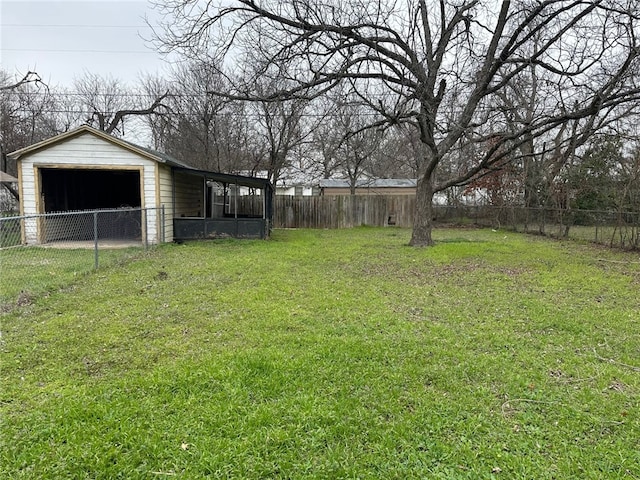 view of yard featuring an outbuilding and fence