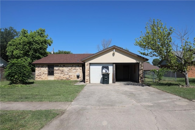 view of front of house with a front yard and a garage