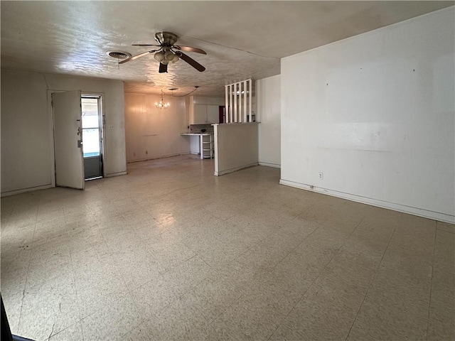 unfurnished living room featuring light floors, baseboards, visible vents, and ceiling fan with notable chandelier