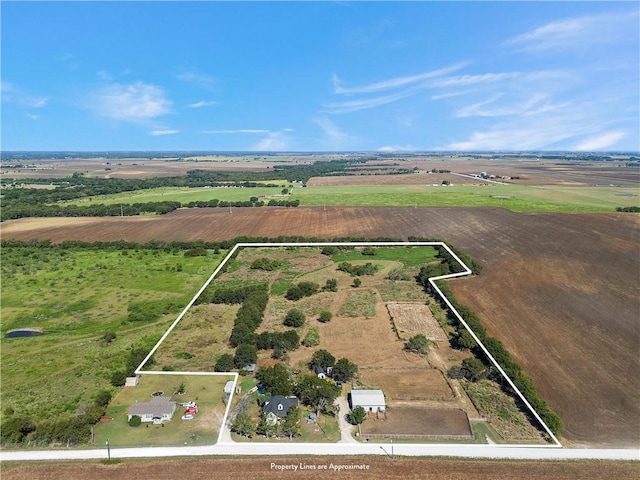 birds eye view of property featuring a rural view