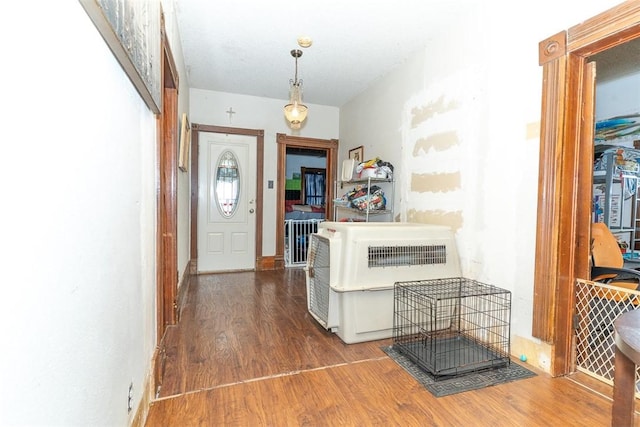 foyer featuring hardwood / wood-style flooring and heating unit