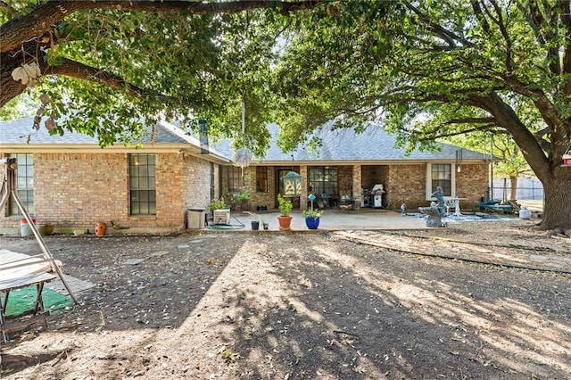 back of property with a patio area