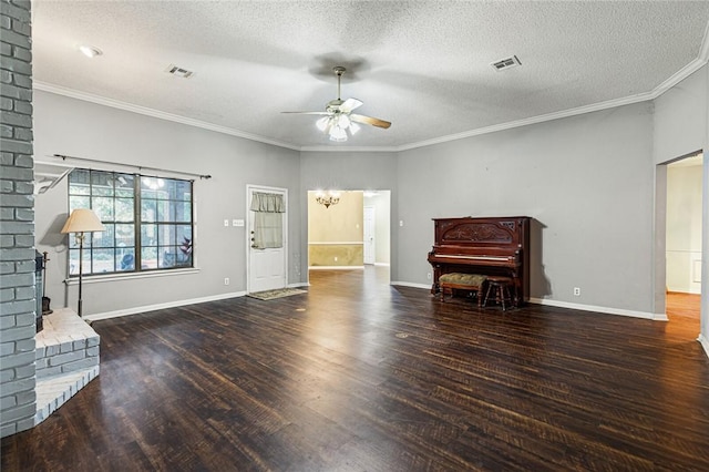 unfurnished living room with a textured ceiling, crown molding, and dark wood-type flooring