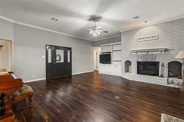 unfurnished living room featuring crown molding, ceiling fan, a fireplace, a textured ceiling, and dark hardwood / wood-style flooring