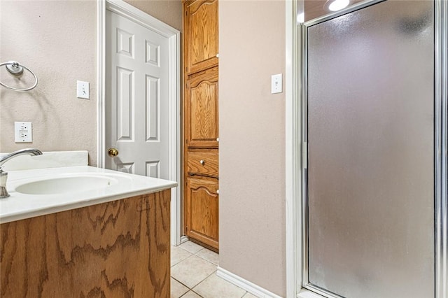 bathroom featuring vanity, tile patterned floors, and an enclosed shower