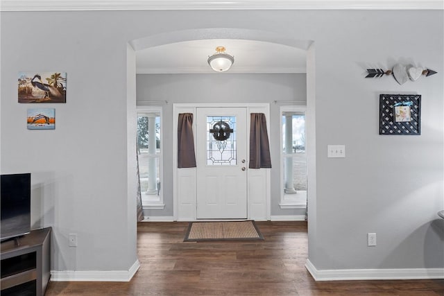 entrance foyer featuring dark hardwood / wood-style floors and ornamental molding