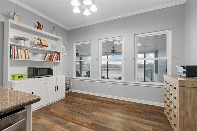 interior space with dark hardwood / wood-style flooring, ornamental molding, and a notable chandelier